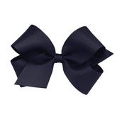 Wee Ones navy grosgrain bow on WeeStay clip stays securely in place all day.