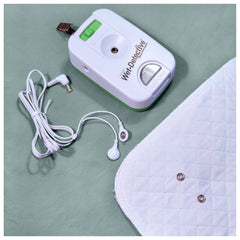 Wet Detective alarm unit at bedside for discreet nighttime alerts.