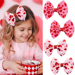 Winthrop Valentine bow hair clip set in red and pink for playful styling.