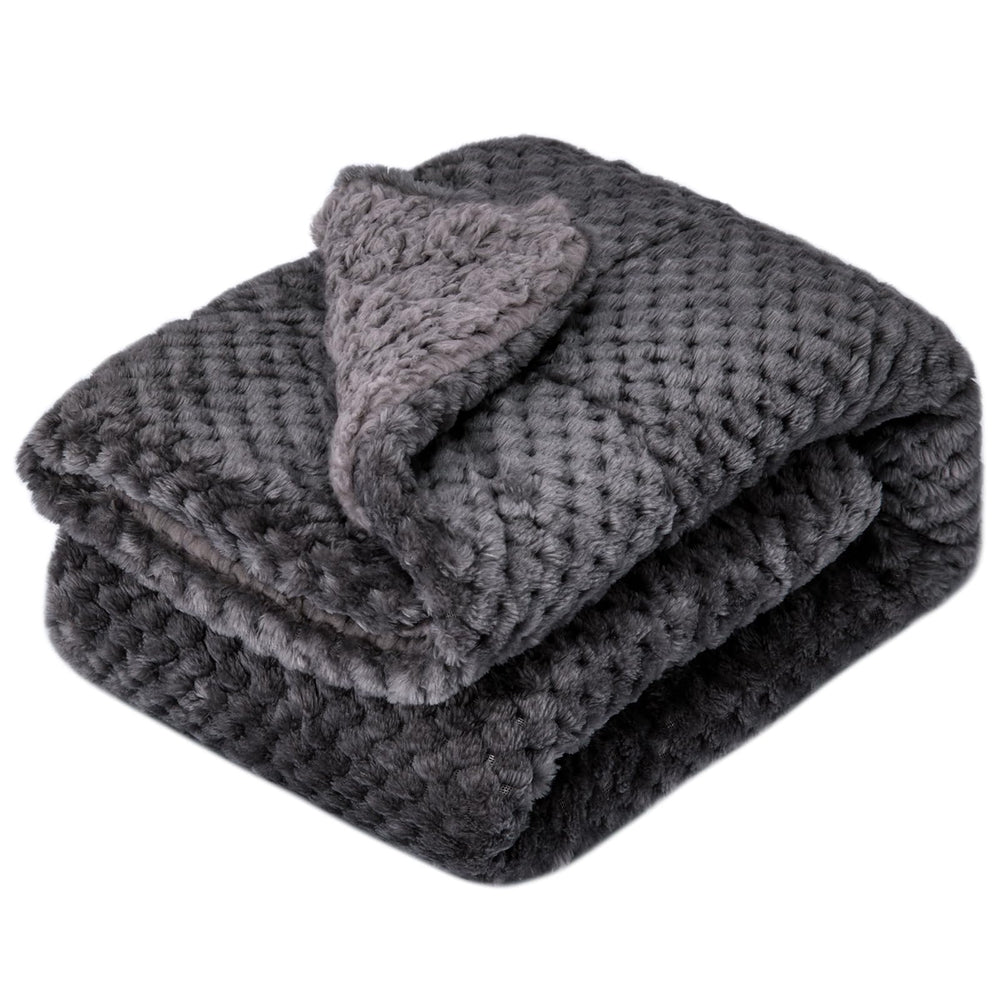 Wonder Miracle fuzzy-sherpa blanket on a baby crib offers soft, warm comfort.