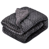 Wonder Miracle fuzzy-sherpa blanket on a baby crib offers soft, warm comfort.