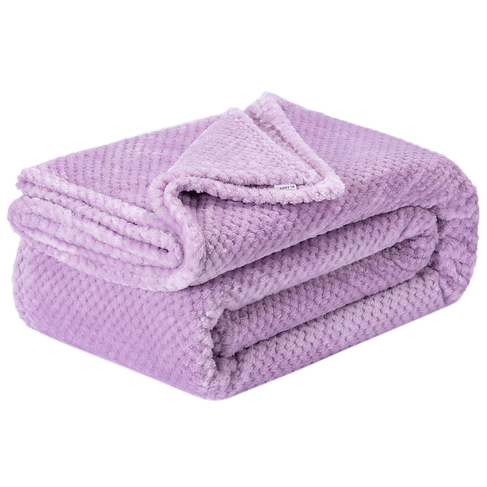 Wonder Miracle fuzzy throw blanket on a bed delivering cozy warmth