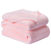 Wonder Miracle fuzzy throw blanket on bed for cozy warmth
