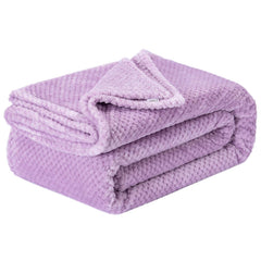 Wonder Miracle fuzzy throw blanket on a bed delivering cozy warmth