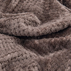Wonder Miracle fuzzy throw blanket compact for travel use.