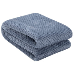 Close-up of Wonder Miracle fuzzy throw blanket showing plush surface for cozy lounging.