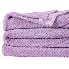 Wonder Miracle plush blanket lavender provides warm comfort on the couch or while traveling.