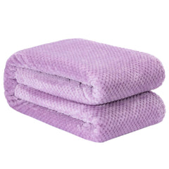 Wonder Miracle plush fleece blanket on couch for movie nights