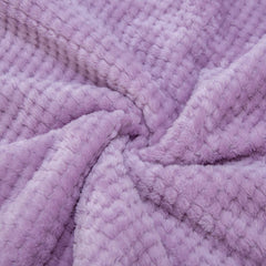 Wonder Miracle travel blanket in lavender, compact and easy to pack for trips.