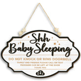 Woodamore Shhh Baby Sleeping Sign on front door with rope hanger for easy display.