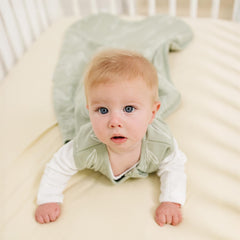 Woolino Sage sleeping bag opened flat for easy dressing and diaper changes.