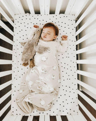 Woolino two-way side zipper detail for quick dressing and diaper changes.