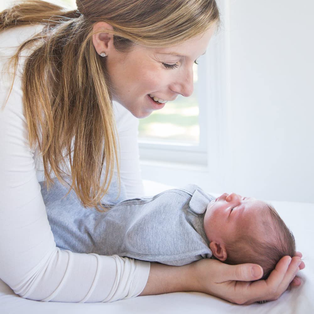 Newborn Woombie Swaddle size supports early weight range for secure wrapping.