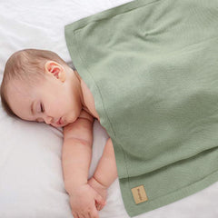 Wugugu baby blanket laid out for cozy snuggle during tummy time