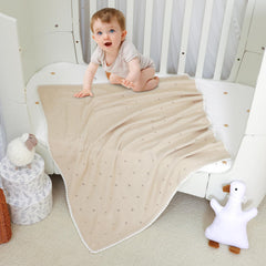 Wugugu unisex knit blanket in color variety supports versatile nursery decor.