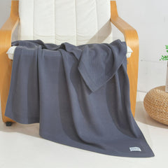 WZOWZO knit baby blanket with geometric cloud pattern adds playful nursery style.