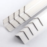 XHWUDI white corner protector showing adhesive back for quick install