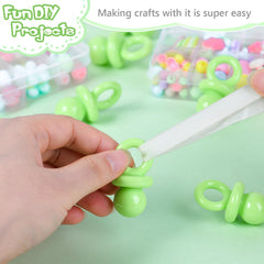 XINHUIDALSQ green pacifiers used to decorate gift bags and tables