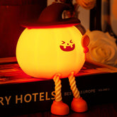 Xinjue pumpkin night light on desk with soft glow for bedtime routines