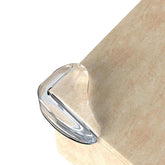 XmHaooL 36-pack corner protectors applied on a desk edge for safe, invisible protection