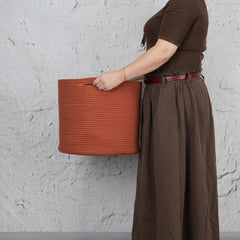XUANGUO decorative basket complements nursery decor while organizing everyday items.