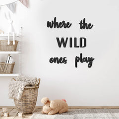 Xylolfsty Where the Wild Ones Play wall sign enhances a playful kids' room decor.