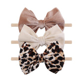 YanJie four-piece Halloween headbands set for newborns and toddlers—soft nylon, comfortable stretch.