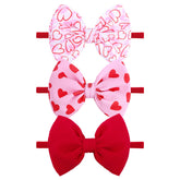 YanJie valentines heart headband in pink for babies with a soft nylon band.