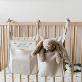 YeeMan linen baby bedside bag on crib front view with two pockets for easy reach