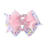 YHXX YLEN pink number-5 birthday bow adds festive sparkle to a girl's hairstyle.