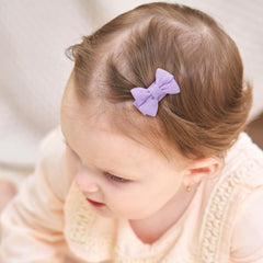 YHXX YLEN mini snap clip bows keeping small bangs neatly in place.