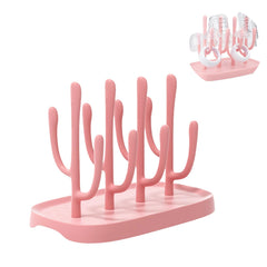 YilulvDeng pink drying rack on countertop for tidy bottle drying.