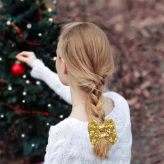 YLOIJO close-up on gold glitter bow sequin detail