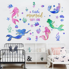 Yovkky shell and starfish wall art adds coastal whimsy.