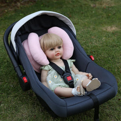 Yufiova banana-shape pillow for baby head-neck support in car seats.