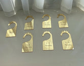 Yuxuanish seven-piece baby closet dividers set on a rod for easy organization.