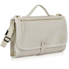 Zaveena portable diaper changing pad in cream exterior for stylish on-the-go changes.