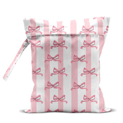 zcyxuuw wet bag front view in pink bow stripes, ideal for beach gear.