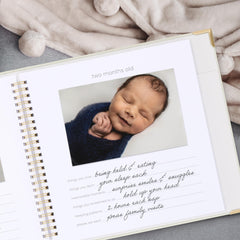 ZICOTO memory book interior pages with milestone prompts and photo slots