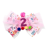 Zlwse birthday hair bow in pink confetti glitter for festive photos.