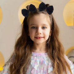 Zolyco Tiny 3-Inch organza bow clip in black adds secure hold for busy mornings.
