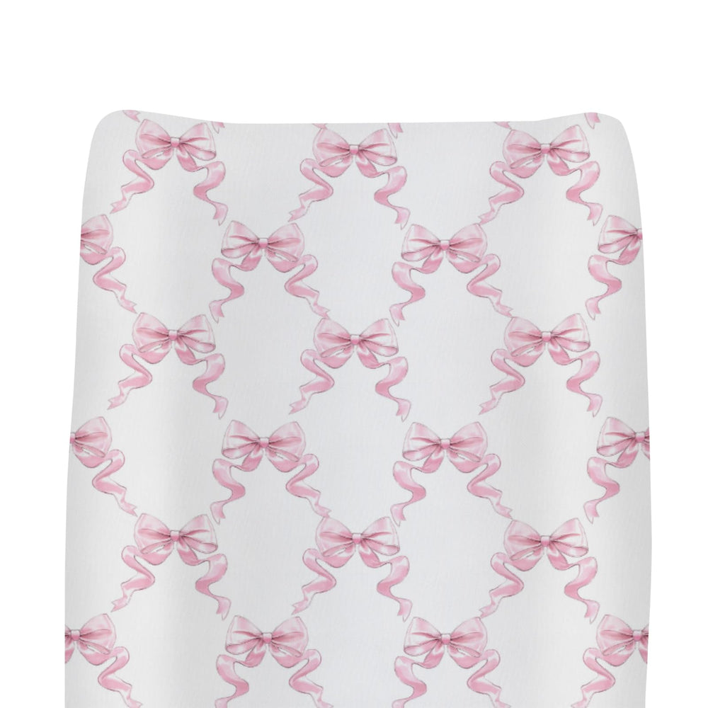 ZoUbqchY Pink Bows changing pad cover, soft pastel pink fabric ideal for diaper changes.