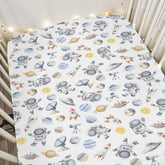 ZoUbqchY Space Astronaut Rocket Watercolor crib sheet for a cozy, engaging nursery.