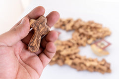Zuluf pocket cross wooden holding, portable faith reminder for meditation and travel.