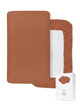 ZURLEFY 52x28 rust muslin crib sheet on a standard mattress for safe sleep.