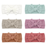 ZURLEFY pink baby headbands with bows closeup to show soft, stretchy fit