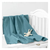 Zurlefy blue muslin blanket close-up shows ultra-soft, breathable fabric for newborn comfort.