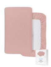 ZURLEFY pink muslin bassinet sheet with elastic bottom for a snug fit.