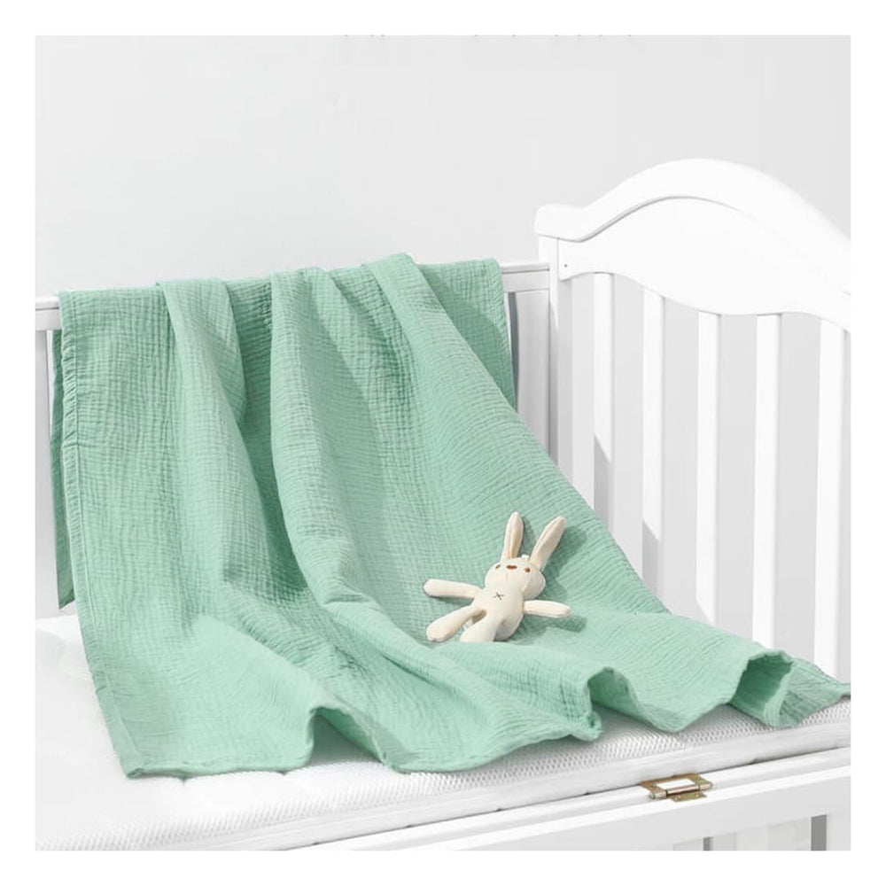 ZURLEFY Sage Green baby swaddle blanket close-up, soft muslin fabric for gentle newborn comfort.