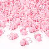 ZYFLSQ pink 200 mini pacifiers scattered on a table for baby shower decor